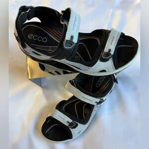 This is a pair of ECCO Women's Offroad or Yucatan sandals in white and black.